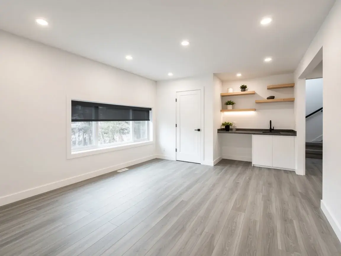 Renovated finished basement with a wet bar
