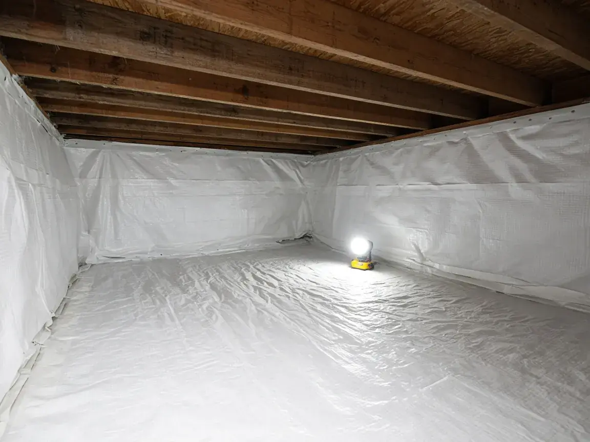 Crawl space fully lined with a white vapour barrier