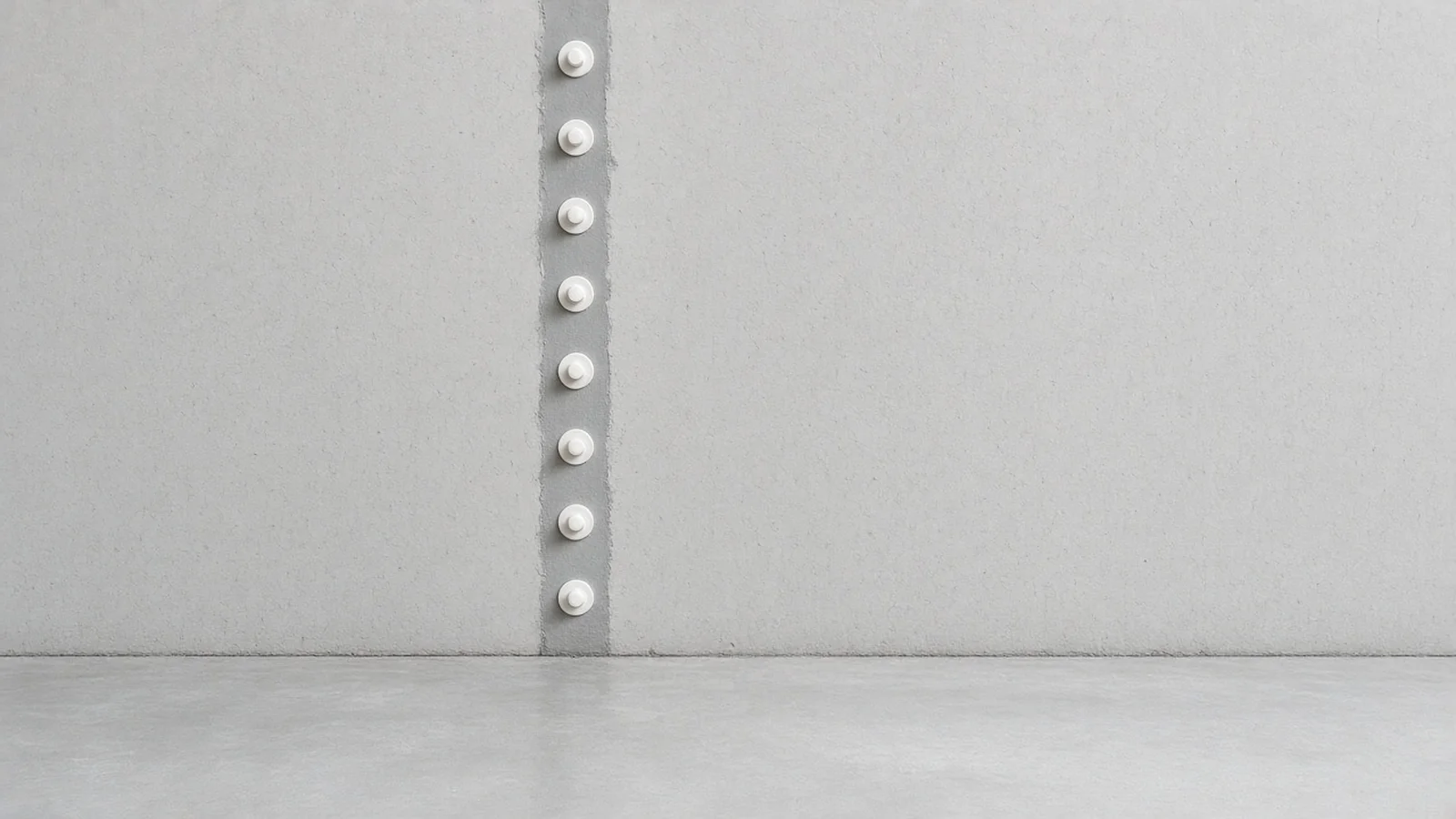 Basement wall crack sealed with a row of injection ports